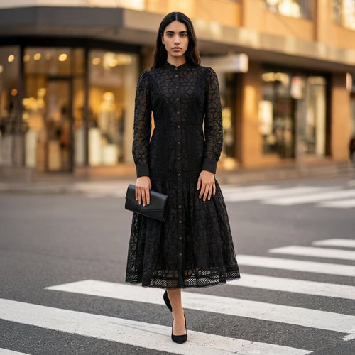 Woman wearing the Celeste Bloom Lace Midi Dress in black, featuring delicate lace, embroidered details and a modest feminine silhouette.