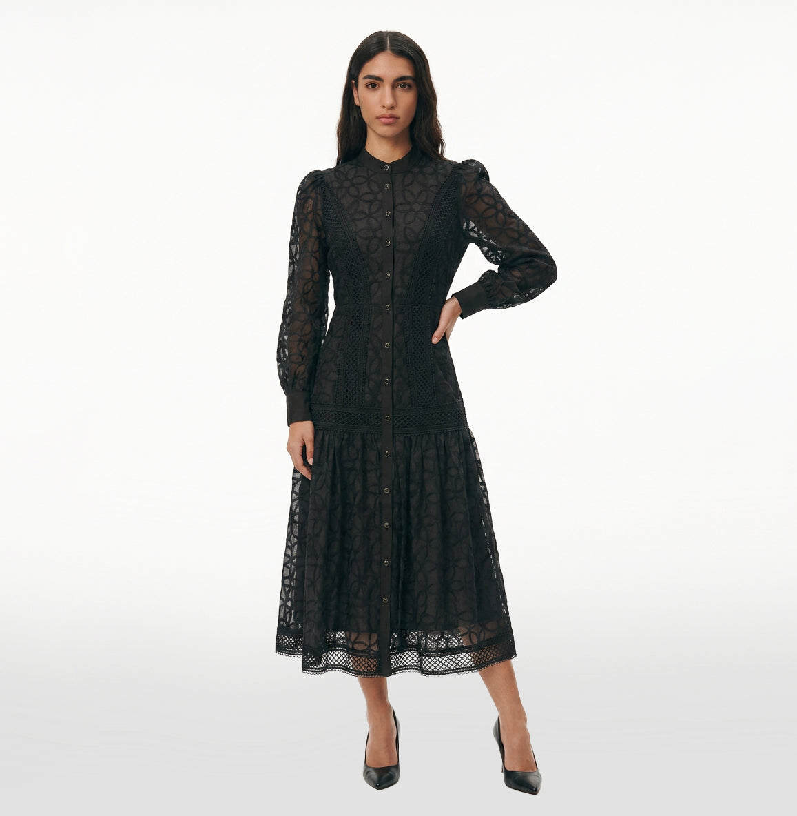 Woman wearing the Celeste Bloom Lace Midi Dress in black, featuring delicate lace, embroidered details and a modest feminine silhouette.