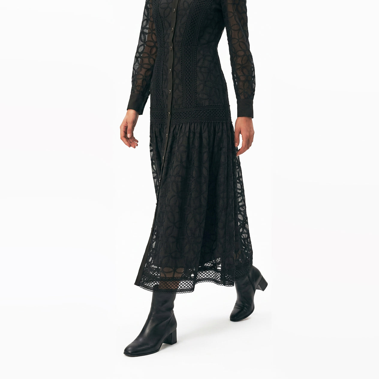 Woman wearing the Celeste Bloom Lace Midi Dress in black, featuring delicate lace, embroidered details and a modest feminine silhouette.