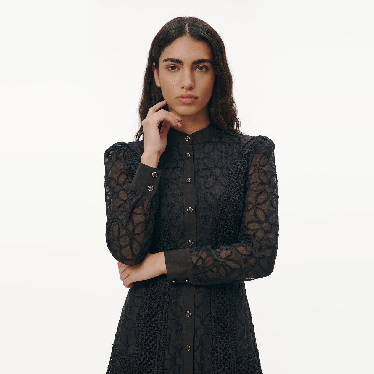 Woman wearing the Celeste Bloom Lace Midi Dress in black, featuring delicate lace, embroidered details and a modest feminine silhouette.