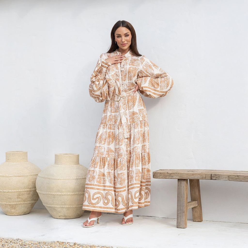 Close-up of the defined waist and Seashells print on a beige modest maxi dress