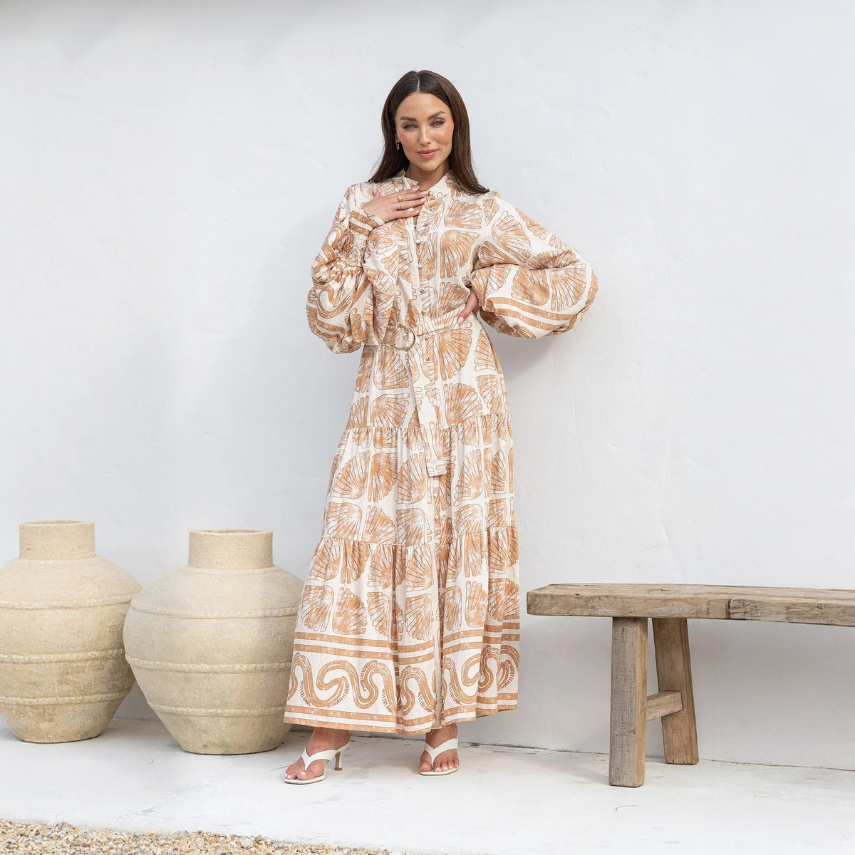 Close-up of the defined waist and Seashells print on a beige modest maxi dress